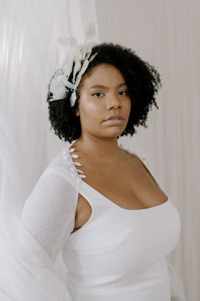 Wedding Shrug made from sustainable 100% Cashmere. Hand crochet silk vines adorn the neckline.  close up front view