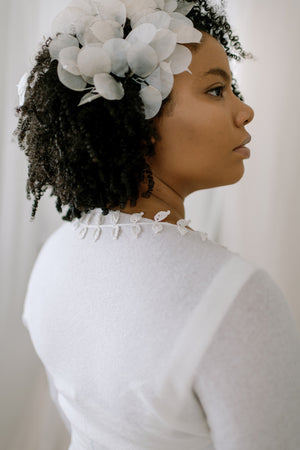 Wedding Shrug made from sustainable 100% Cashmere. Hand crochet silk vines adorn the neckline.  Detail back view
